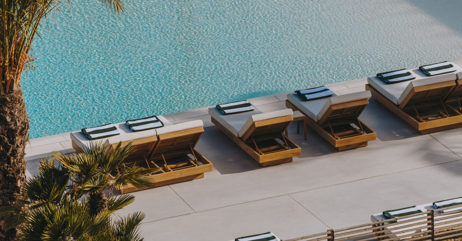 Poolside loungers overlooking the infinity pool at Fairmont Residences La Hacienda