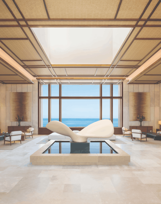 Fairmont La Hacienda hotel lounge with a reflecting pool and sea views, part of the resort surrounding these luxury branded homes