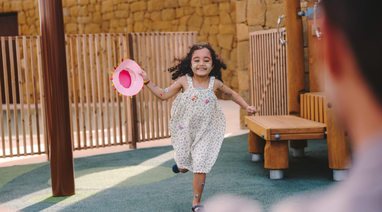 Girl playing at the children's play area of the luxury branded residences near Sotogrande Spain